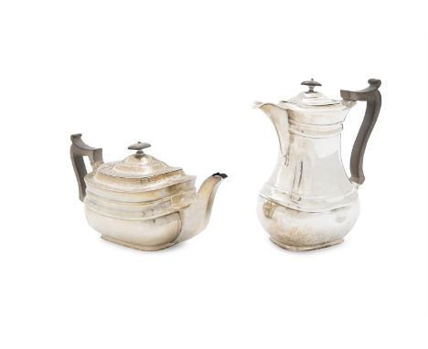 AN EDWARDIAN SILVER TEAPOT AND HOT WATER POT, London 1907, mark of William Hutton & Sons Ltd, each of rectangular baluster fo