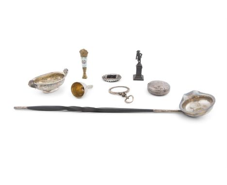 A CONTINENTAL WHITE METAL WINE TASTER, 18th century of oval shape with raised side handles and inset with a Georgian coin, 10