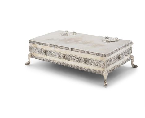 A SILVER CELTIC REVIVAL TABLE CASKET, Dublin 1910, mark of West & Sons, of rectangular form with fitted timber interior, and 