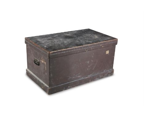 A LATE 19TH CENTURY TRAVEL TRUNK, of rectangular form, with hinged cover and twin side handles, applied with old travel label
