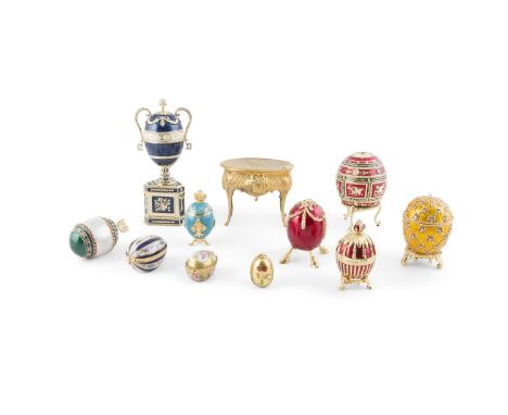 A COLLECTION OF RUSSIAN 'Faberge' jewelled eggs, (modern), comprising seven various coloured enamel eggs, each with hinged co