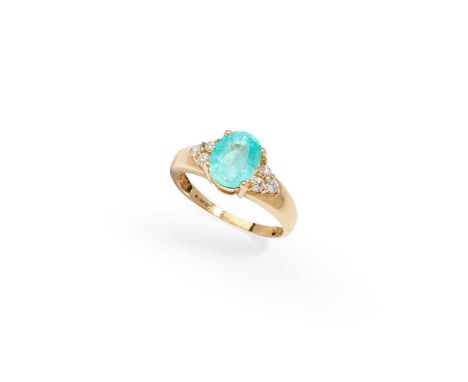 A paraiba tourmaline and diamond ring  The oval-cut paraiba tourmaline, between brilliant-cut diamond three-stone shoulders, 