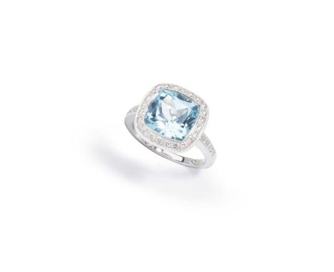 Boodles: A blue topaz and diamond ring The cushion-shaped blue topaz within a brilliant-cut diamond surround and shoulders, m