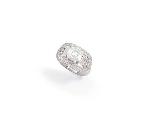 A diamond dress ring Set with a cluster of vari-shaped step-cut diamonds, within a brilliant and tapered baguette-cut diamond