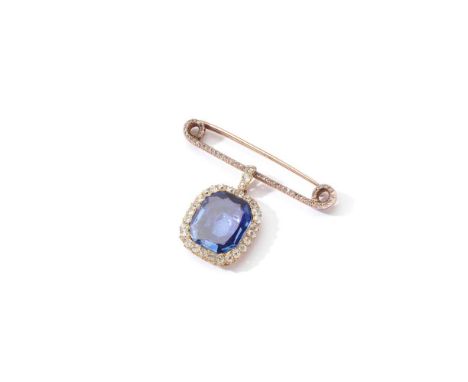 A late 19th century sapphire and diamond brooch Designed as a rose-cut diamond safety pin, suspending a cut-cornered step-cut
