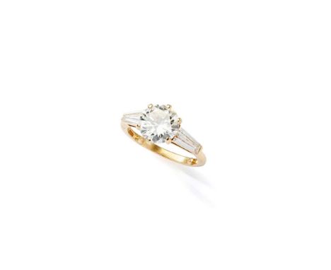 A diamond single-stone ring The brilliant-cut diamond, weighing 1.77 carats, between tapered baguette-cut diamonds, mounted i