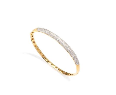 A diamond-set bangle The polished hinged bangle, pavé-set to the front with brilliant-cut diamondsDimensions:Inner diameter: 