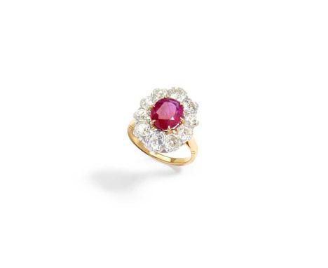 A ruby and diamond cluster ring The oval-cut ruby within an old brilliant-cut diamond surroundAccompanied by a GCS report sta