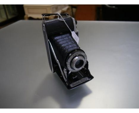 A Kodak Junior Dakon II shutter camera with 105mm Anaston G/6.3 lens mount 320 Kodak London