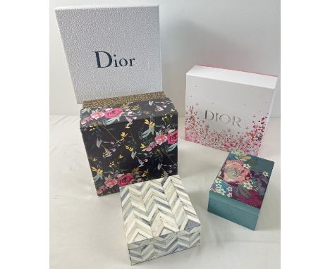 A collection of decorative boxes. To include 2 x Dior cosmetic boxes, a floral design wooden box by Gisela Graham and a white