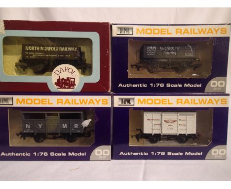 Four OO scale Dapol wagons to include North Norfolk Railway, Keep Scotsman Steaming, N.Y.M.R brake van, S.V.R van. All in exc