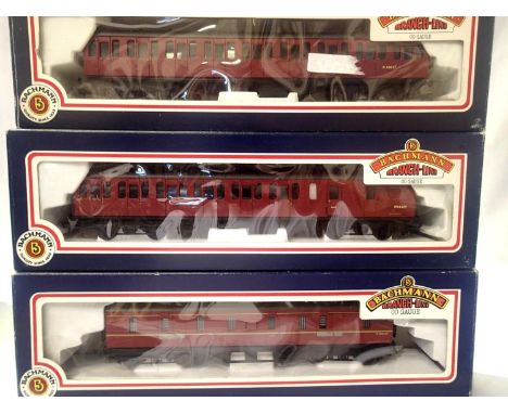 Three OO scale Bachmann BR MK1 Suburban coaches; open and brake end and a parcels van. All maroon, in excellent condition, we