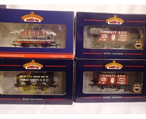 Four OO scale Bachmann collectors club exclusive wagons, including 1997 Bachmann Times 70,000 wagons built by Charles Roberts