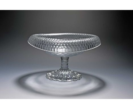 An Irish cut glass bowl or centrepiece, c.1820, of navette shape, the turnover rim cut with bands of fluting, raised on a bob