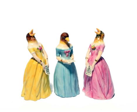 Three Royal Worcester candle snuffers, date codes for 1924 and 1925, of Confidence and Diffidence, depicting the singer Jenny