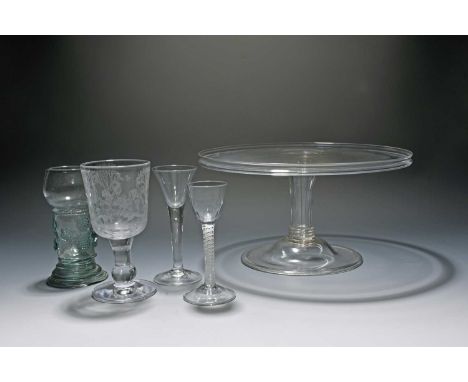 An English glass roemer for the export market, 18th century, the cup shaped bowl raised on a wide stem with raspberry prunts,