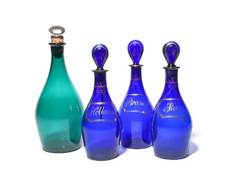 Three blue glass decanters and stoppers, c.1800, of mallet shape, each gilded with a bottle ticket titled 'Brandy', 'Rum' and