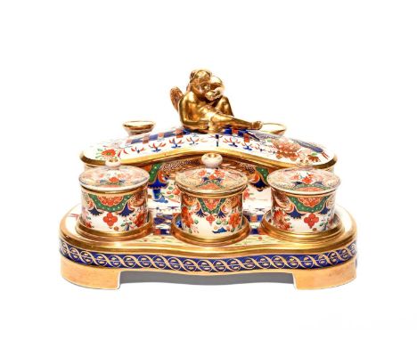 A Spode inkstand, c.1815-25, decorated in an extended Imari palette in pattern 967, the shaped stand fitted with two pounce p