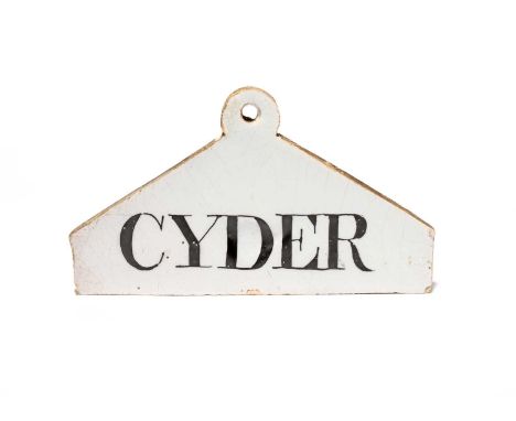A delftware bin label, c.1770-80, of coathanger form, painted in black with 'CYDER', 13.7cm across.