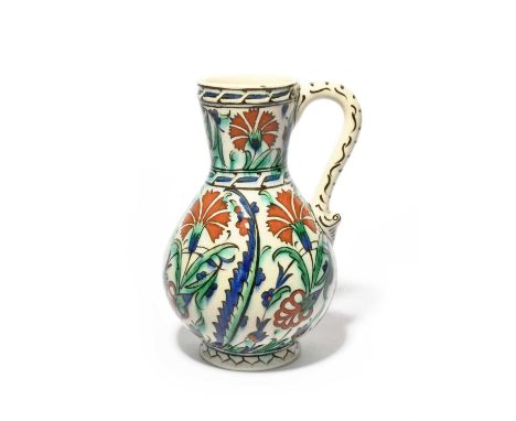 A Continental Iznik-style jug, late 19th century, probably Samson, boldly painted in traditional style with red carnations be