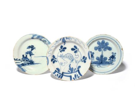 Three delftware plates, c.1740-60, of primitive shape, one painted in blue with a squirrel among vine, another with sponged t