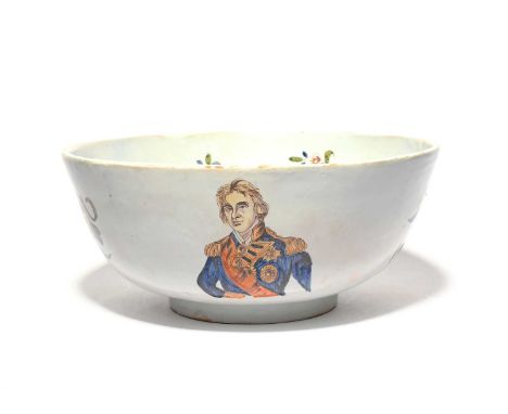 A delftware punch bowl, 19th century, the exterior with a portrait of Admiral Nelson, a ship and polychrome flowers issuing f