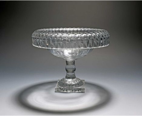 An Irish cut glass tazza or centrepiece, early 19th century, the circular bowl with a deep everted rim cut with a rhomboid de