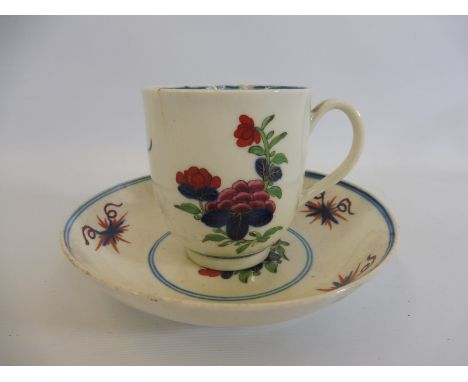 A 1st Period Worcester cup and saucer of simple floral design. 