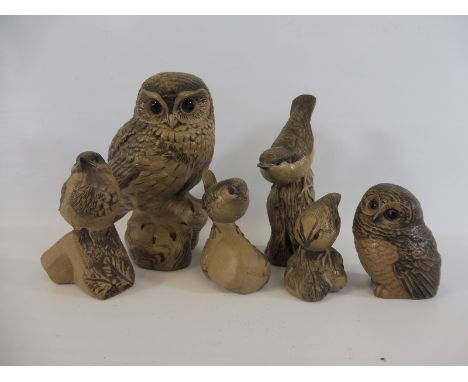 A group of Poole pottery birds including a large seated owl. 