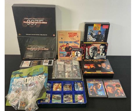 A collection of JAMES BOND memorabilia including limited edition VHS sets, a quantity of trading cards, YOU ONLY LIVE TWICE b