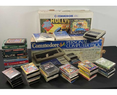 COMMODORE - A boxed COMMODORE 64 and COMMODORE 64C Hollywood Edition computer together with a quantity of boxed video game ca