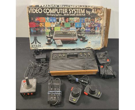 ATARI - An Atari 2600 console with joysticks, controllers and video touch pad, original box but missing interior packaging.PL