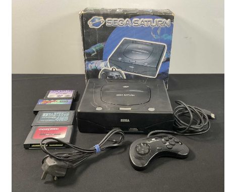 SEGA SATURN - A boxed SEGA SATURN console with original controller and power supply together with 3 Japanese Memory cards and