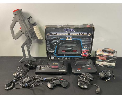 SEGA MEGA DRIVE - An unboxed SEGA MEGA DRIVE II console, 2 original controllers, power supply and RF cable together with a Se