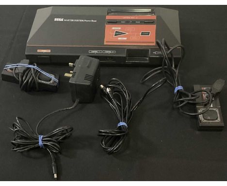 SEGA MASTER SYSTEM - A Sega Master System / Power Base console and two controllers, power supply and RF cablePLEASE READ CARE
