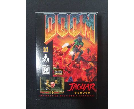 ATARI JAGUAR - A boxed copy of DOOM (id Software, 1994) missing cardboard inner sleeve, reproduction instruction manual, clas