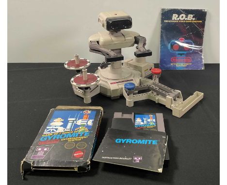 NINTENDO - An unboxed NINTENDO R.O.B. (Robot Operating Buddy) with instructions, and boxed GYROMITE video game with instructi