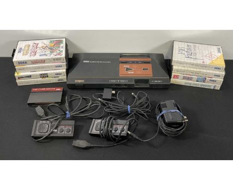 SEGA MASTER SYSTEM - An unboxed Sega Master System Console (PAL), 2 controllers and power cable together with 8 boxed video g