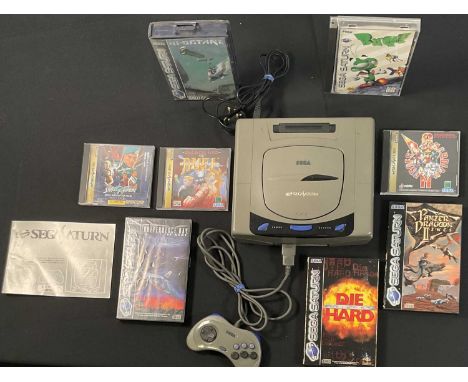 SEGA SATURN - An unboxed Sega Saturn games console with original controller and power supply together with boxed video games 