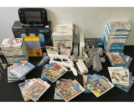 NINTENDO WII - A Nintendo Wii bundle to include a boxed WII U Mario Kart Premium Pack - missing cables, a loose Wii U console