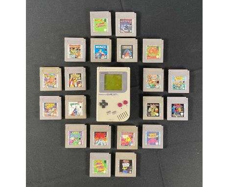 NINTENDO GAME BOY - An original Nintendo Game Boy (missing battery cover) together with 20 loose video game cartridges includ