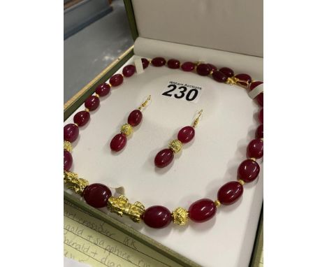 Ruby necklace and drop earing jewellery set, colour enhanced with dragon design, clasp stamped 18ct