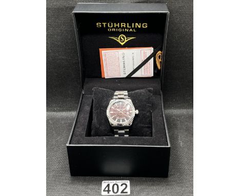 A Stührling “Northstar 892.02” GMT quartz wristwatch, 42mm case, stainless steel strap, water resistant 50M. As new with box,