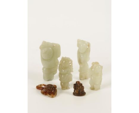 A GROUP OF FIVE CHINESE JADE AND AGATE CARVINGS, comprising four of boys, 19th/20th century, largest 7cm, an agate lotus, 3.2