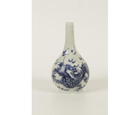 A CHINESE BLUE AND WHITE PORCELAIN DRAGON VASE of bottle shape painted with a lively dragon amongst cloud wisps, Qing dynasty