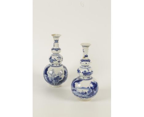 A PAIR OF CHINESE BLUE AND WHITE TRIPLE-BULB VASES the lower body painted with a scholar and attendant near a pavilion in lak