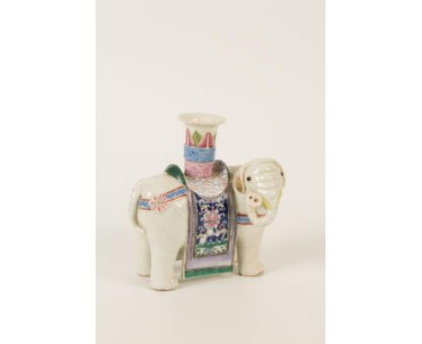 A CHINESE FAMILLE ROSE ELEPHANT JOSS STICK HOLDER, modelled standing, a nozzle on its saddled back, in enamel colours, 19th c