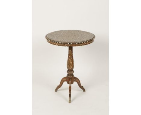 AN INDIAN BONE INLAID HARDWOOD TRIPOD OCCASIONAL TABLE , the circular top with foliate detail in widening circles, baluster s