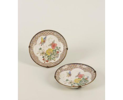 A PAIR OF CANTON ENAMEL SAUCER DISHES, each delicately painted with butterflies alighting on mixed flower sprays, within cell