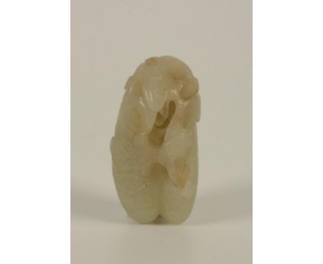 A CHINESE PALE CELADON JADE DOUBLE FRUIT PENDANT, the openwork stalks carved with fruiting fungus, Qing Dynasty, 19th century